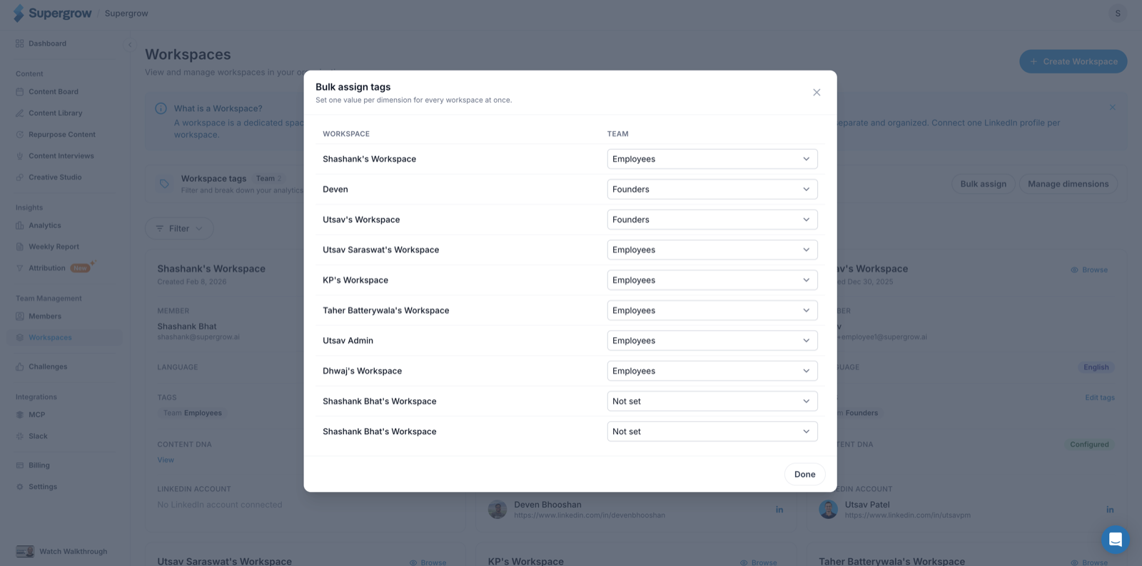 The bulk assign tags dialog, listing every workspace with a dropdown to set its value for the Team dimension